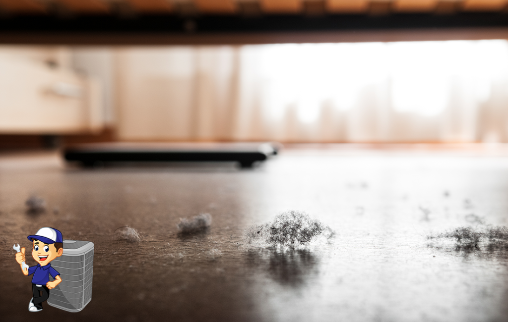 Detail of dust and dirt heap accumulated on a parquet floor under a bed.